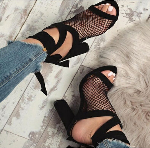 Close-up of ankle lace-up tie detail on strappy heel sandal