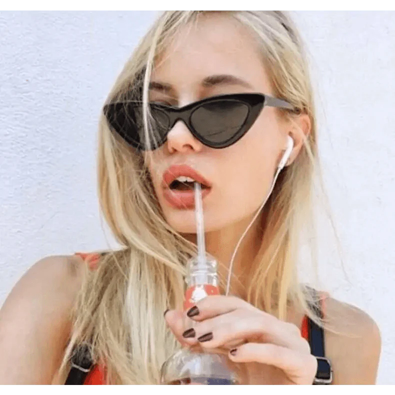 Women's retro sunglasses styled for beach vacation