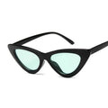 Black cat-eye sunglasses with light blue lenses on a white background