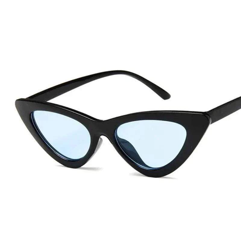 Black cat-eye sunglasses with light blue lenses on a white background